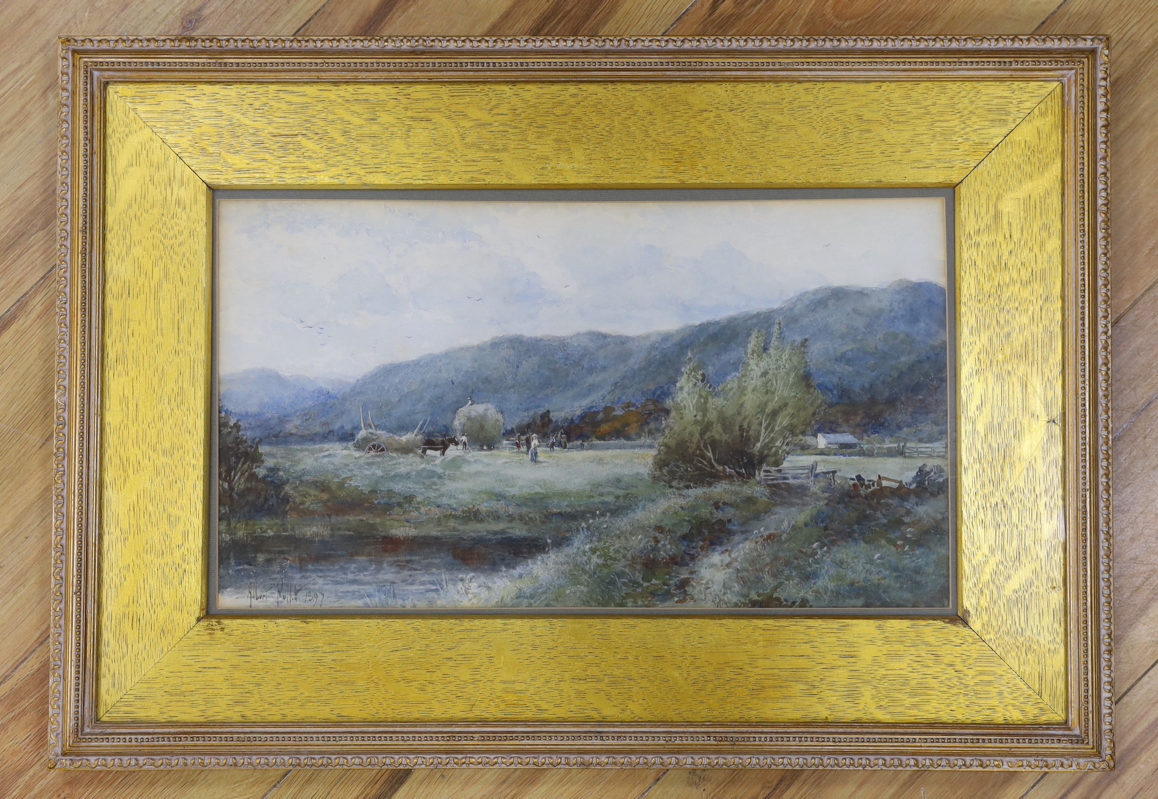 Albert Pollitt (1856-1926), watercolour, Harvesters viewed from across a river, signed and dated 1897, 24 x 44cm